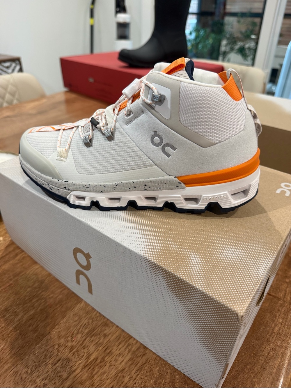 On Running women Trail Sneaker- cloudtrax - White & Orange